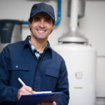 technician servicing an hot-water heater